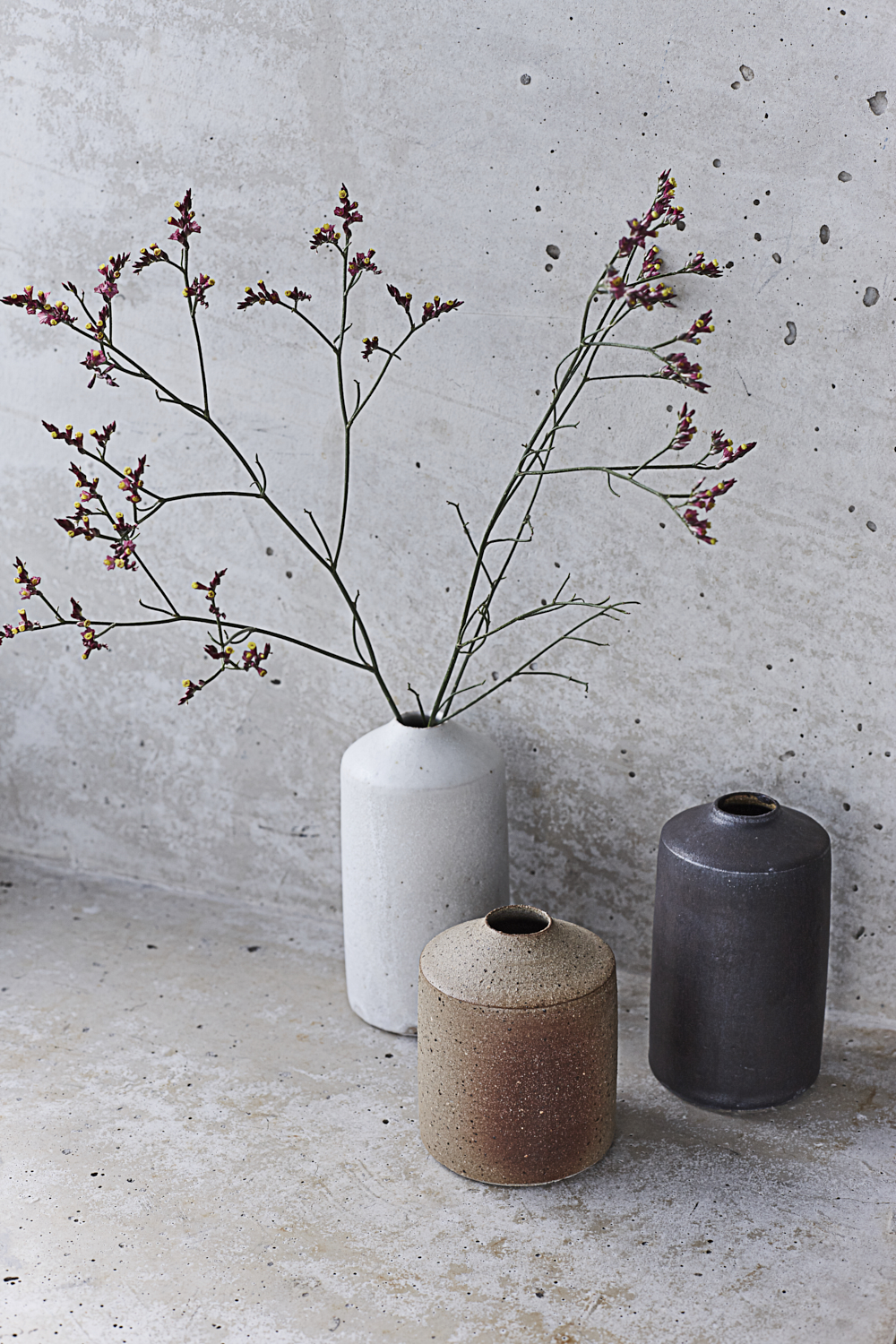 Ceramic vases and concrete. Still life photography by Joanna Henderson